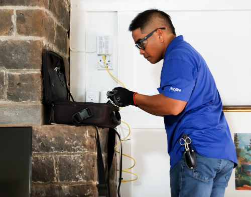 Technician Installing Equipment